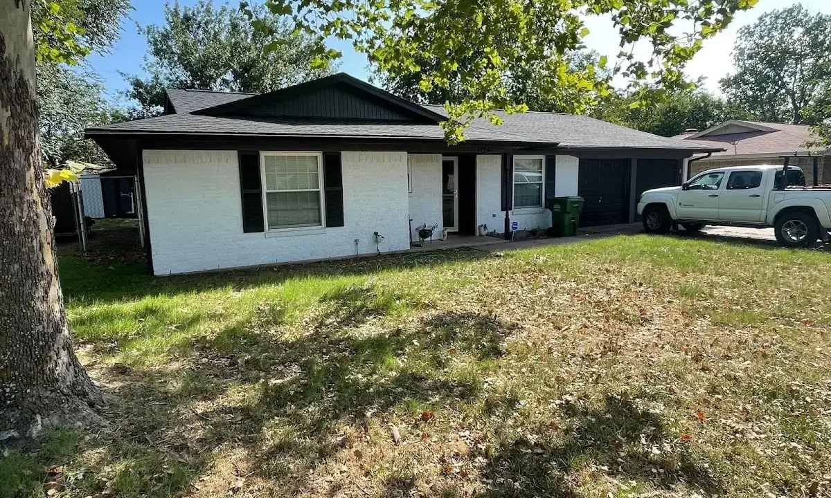 Professional roofing crew working on a residential roof in Austintown